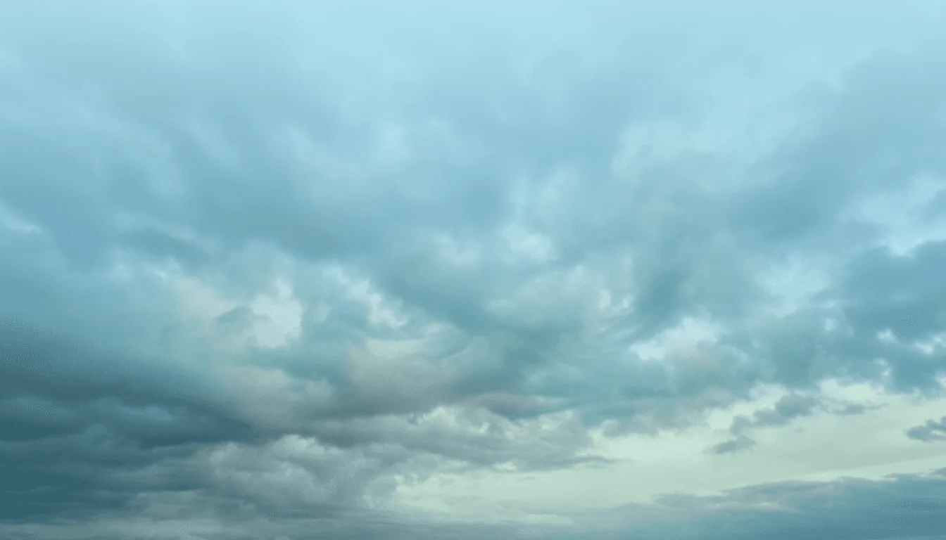 Cloudy sky with grey-blue overcast and soft light.